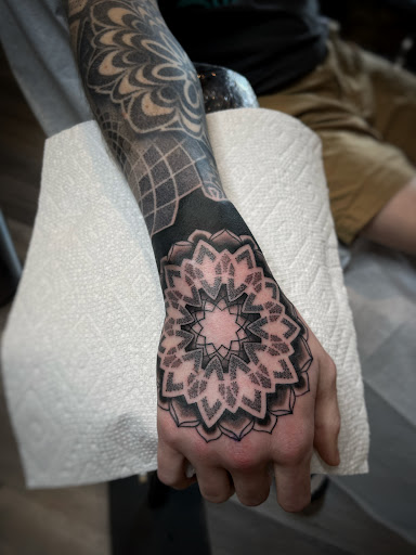 Explore healing symbol tattoo ideas, creative tattoo ideas in Lawrence, available at Black Chapel Tattoo
