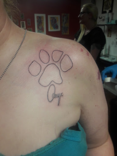Explore small paw print tattoo ideas, creative tattoo ideas in Center Line, available at Elite Ink Tattoo Studios