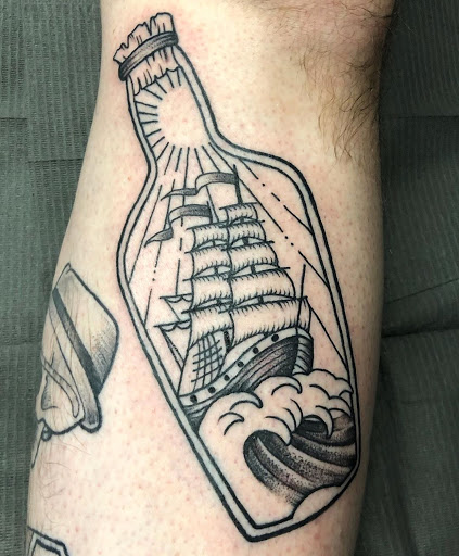 Explore charm tattoo ideas, creative tattoo ideas in Dayton, available at 33 Lions Tattoo