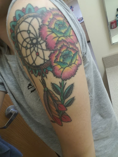 Explore collarbone tattoo ideas men, creative tattoo ideas in Kansas City, available at Grimm Tattoo and Bert Grimm Museum