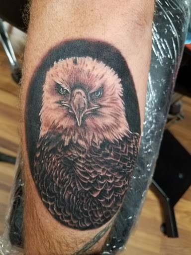 Find bracelet tattoo ideas for females for your next unique tattoo in Watford City at The Ink Well Tattoo & Body Piercing