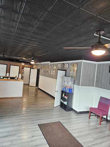 Explore lily flower tattoo ideas, creative tattoo ideas in Cumberland, available at Queen City Ink