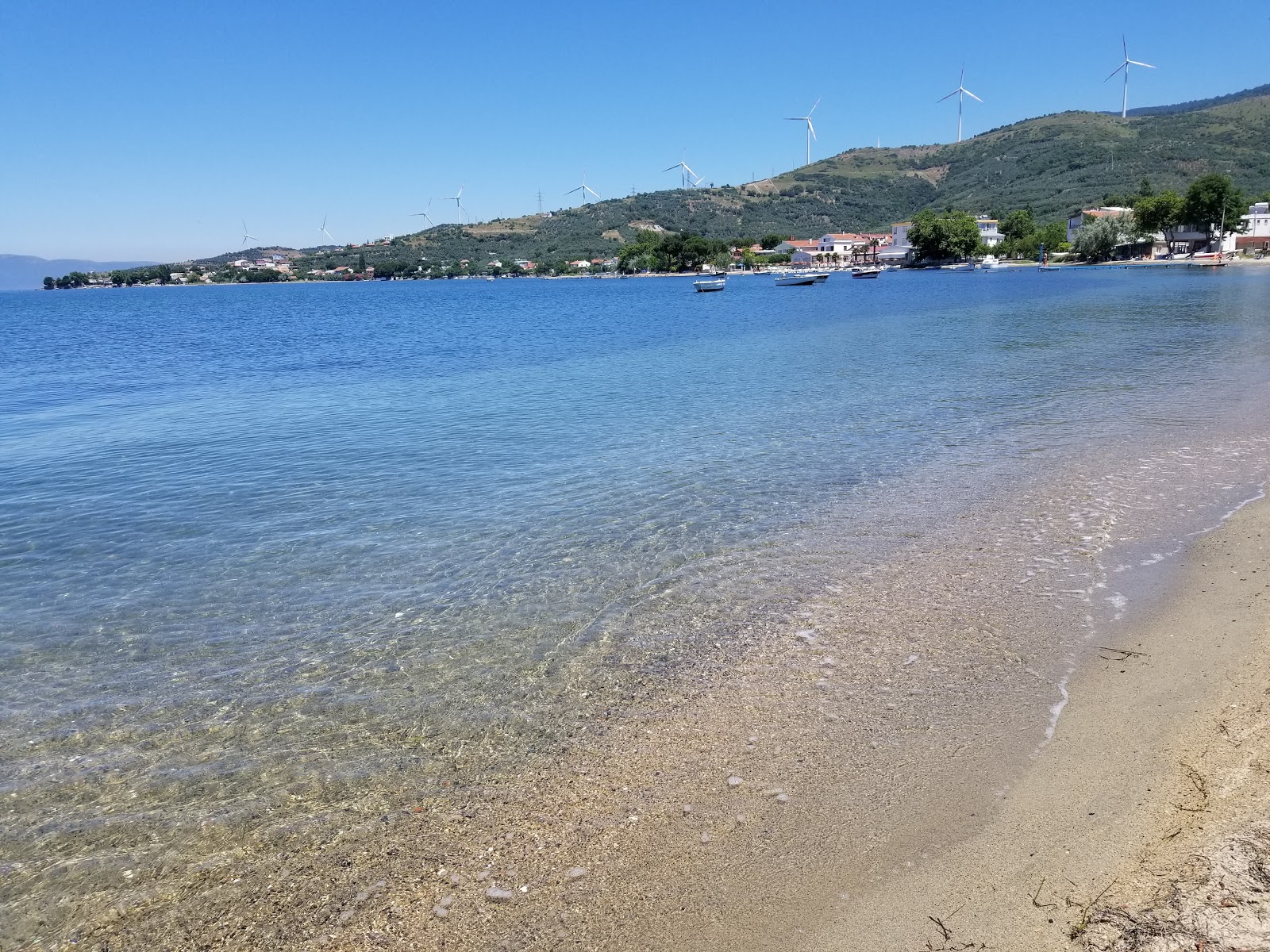 Fotografie cu Narli beach II cu o suprafață de apa pură turcoaz