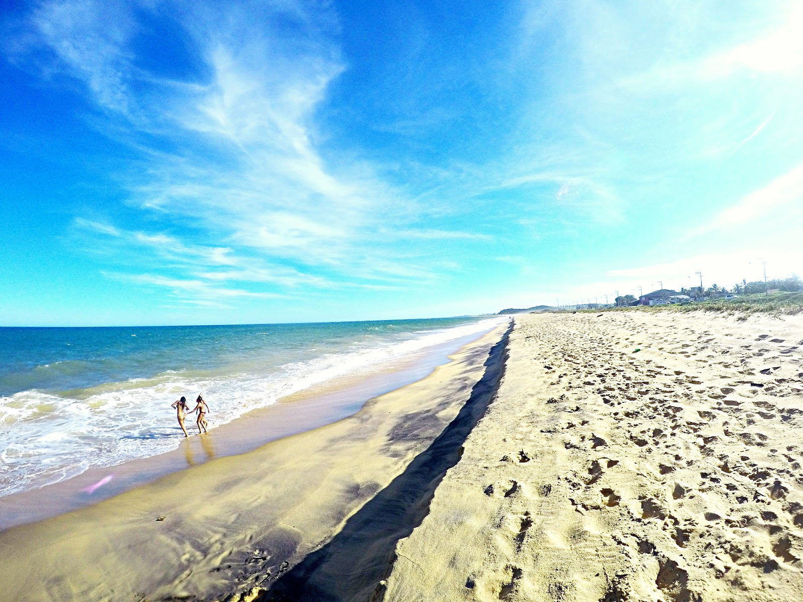 Foto van Riacho Beach met recht en lang