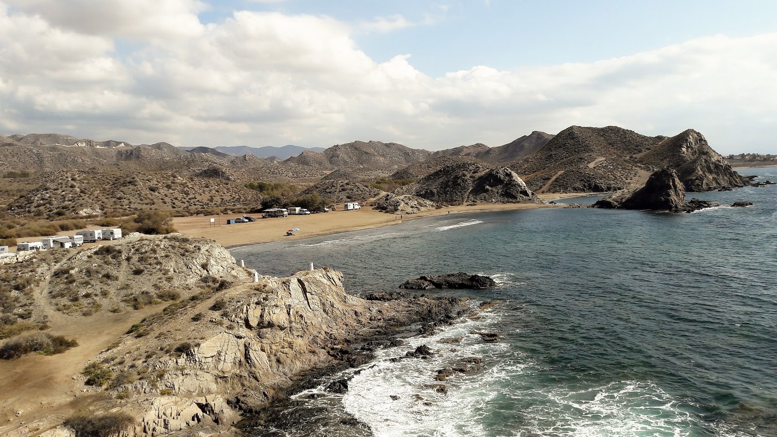 Foto von Playa del Arroz mit blaues wasser Oberfläche