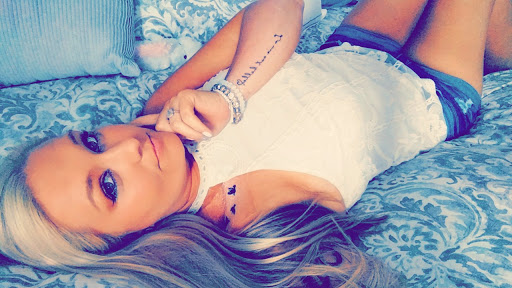 Explore cross hand tattoo ideas, creative tattoo ideas in Asheboro, available at Wonderland Tattoo