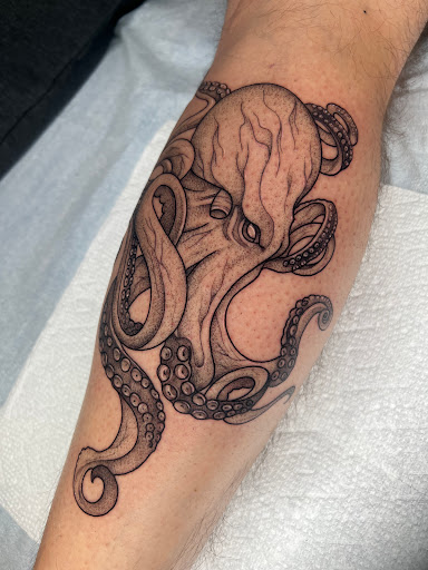 Explore lower leg tattoo ideas male, creative tattoo ideas in Strasburg, available at Black Orchid Tattoo