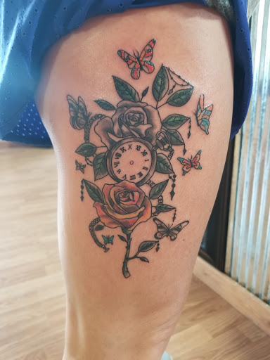 Explore tattoo ideas behind the ear tattoos, creative tattoo ideas in Greenwood, available at The Center Street Parlour