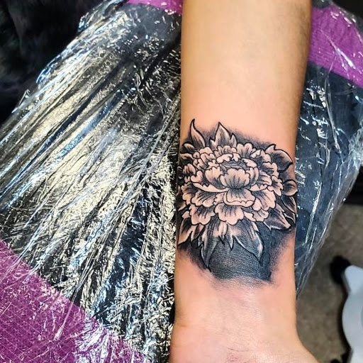 Explore tattoo handwriting ideas, creative tattoo ideas in Windsor Locks, available at Reigning Ink Tattoo Studio