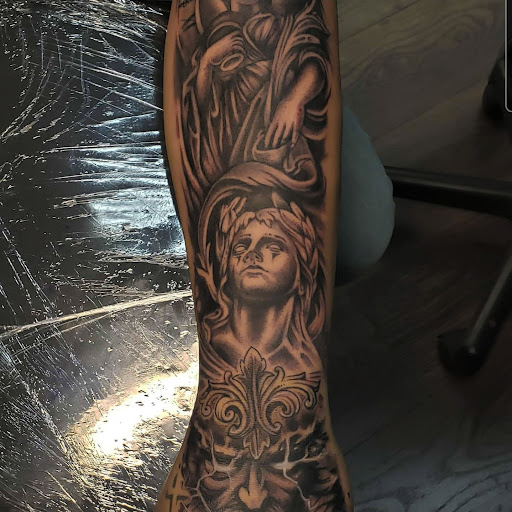 Explore badass mens tattoo ideas, creative tattoo ideas in Orange, available at Three Diamonds Tattoo