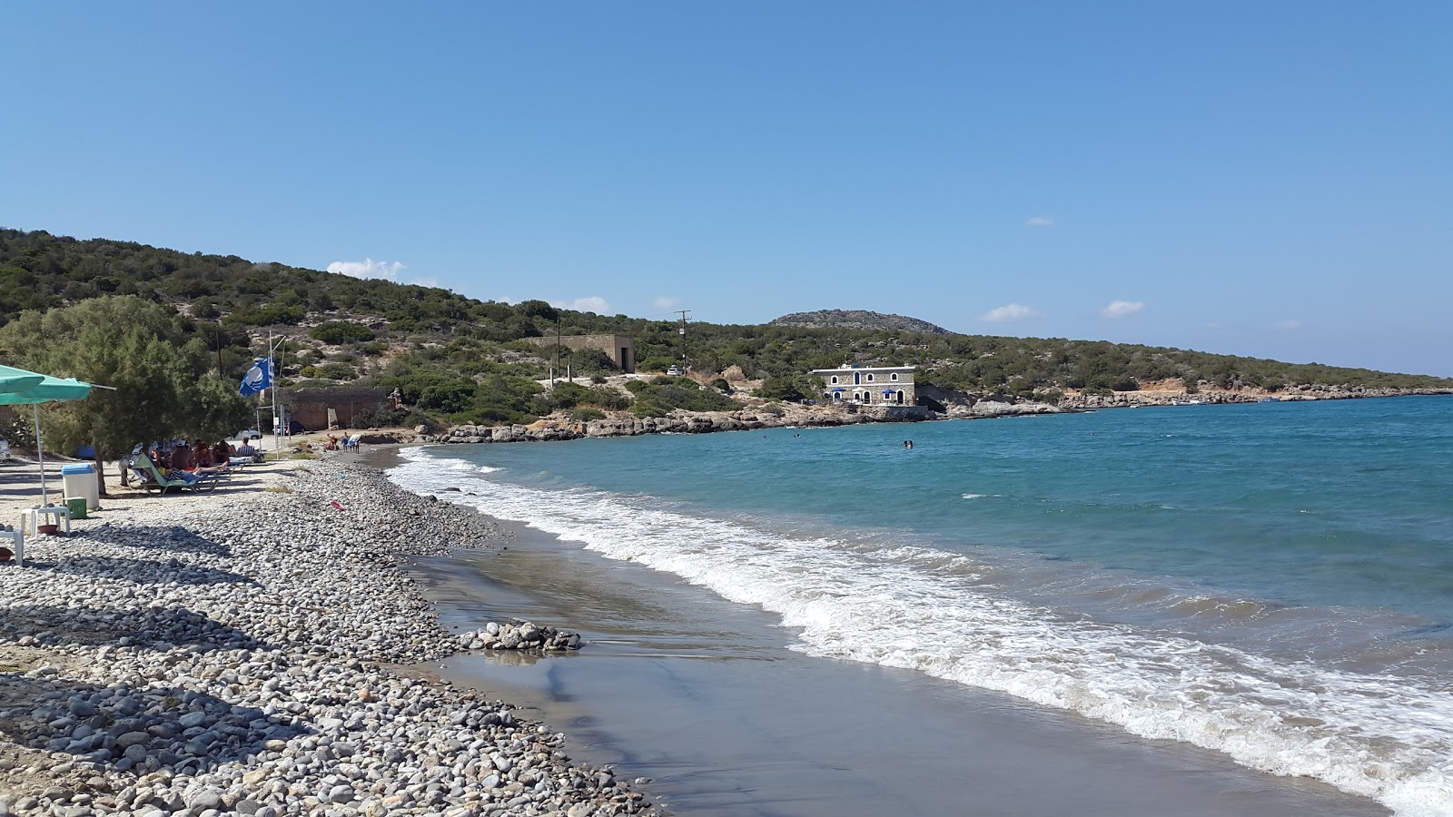 Photo of Karavostasi with blue pure water surface