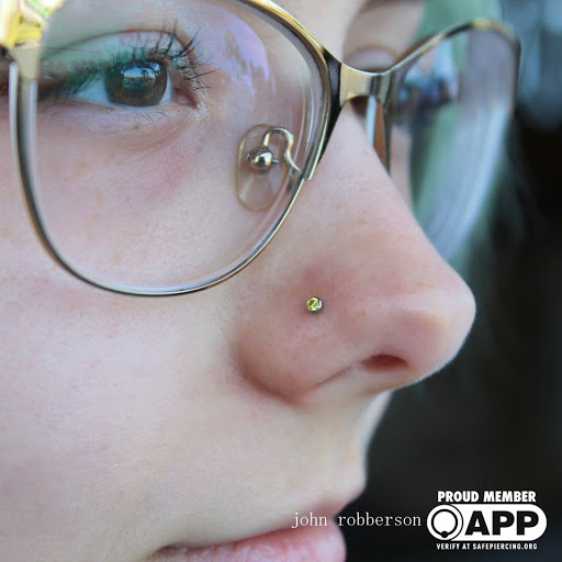 Explore safety pin tattoo ideas, creative tattoo ideas in Fort Myers, available at Tiger Lotus Tattoo and Piercing