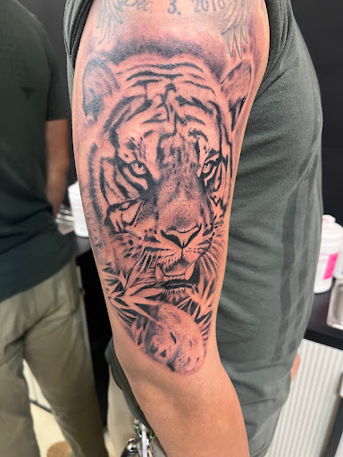 Explore fire sign tattoo ideas, creative tattoo ideas in Lakeville, available at Savage Ink