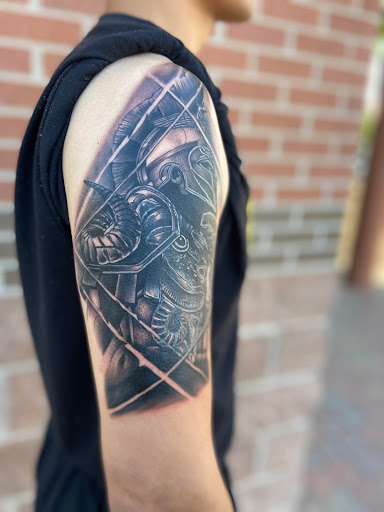Explore aquarius tattoo ideas for men, creative tattoo ideas in El Paso, available at American Tattoo Society of Ft Bliss