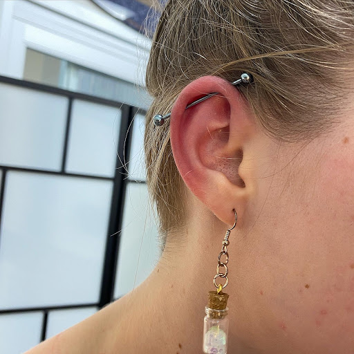 Explore gladiolus tattoo ideas, creative tattoo ideas in Cary, available at Fine Art Body Piercing By Lilith Mae