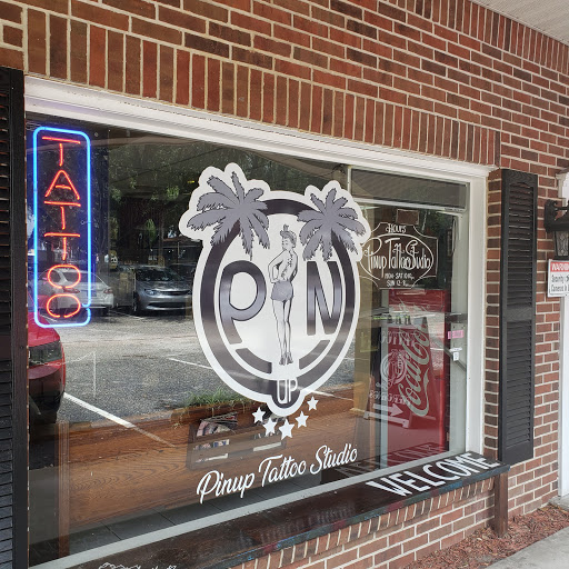 Explore small dragon tattoo ideas, creative tattoo ideas in Brandon, available at Pinup Tattoo Studio