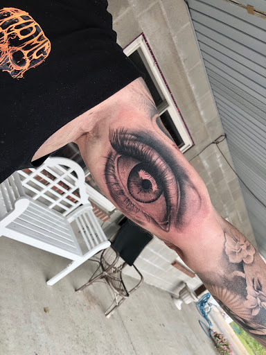 Explore minimalist tattoo ideas for men, creative tattoo ideas in Middletown, available at Traditionally Twisted Tattoo