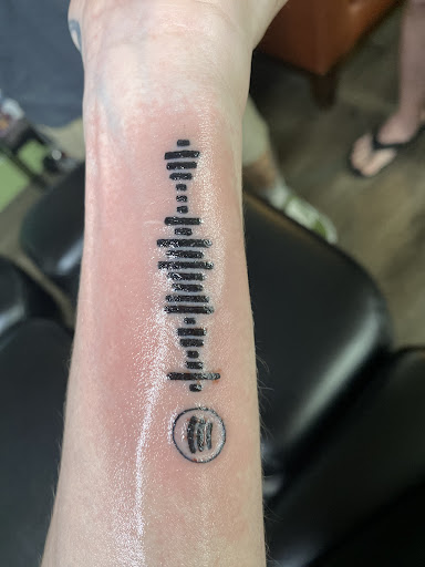 Explore iris flower tattoo ideas, creative tattoo ideas in Savannah, available at Tramp Art Studios