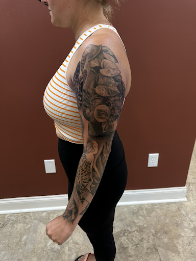 Explore knee scar tattoo ideas, creative tattoo ideas in Nashville, available at RedBird Tattoo