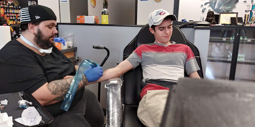 Explore mens arm tattoo ideas small, creative tattoo ideas in Flint, available at Studio 42 Tattoo