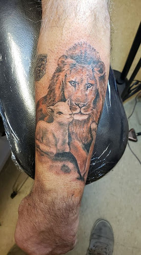 Explore wrist tattoo ideas for guys, creative tattoo ideas in Flint, available at Black Eye Social Club Tattoo