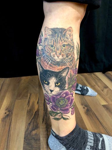 Explore tulip tattoo ideas, creative tattoo ideas in Peoria, available at Iron Key Tattoo Studio Inc.