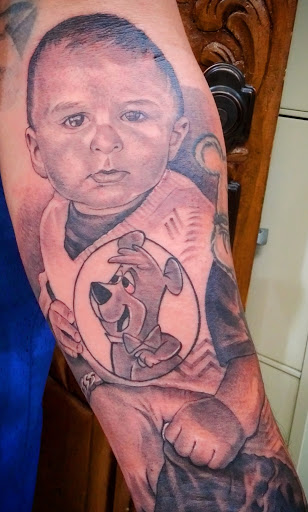 Explore lower back cover up tattoo ideas, creative tattoo ideas in Fountain Valley, available at Lowrider Tattoo Studios