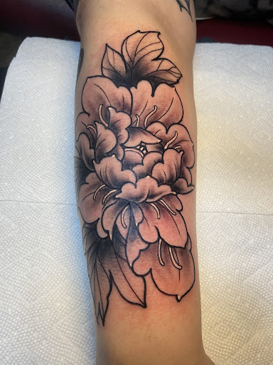 Explore tramp stamp lower back tattoo cover up ideas, creative tattoo ideas in Peabody, available at Thousand Needles Tattoo