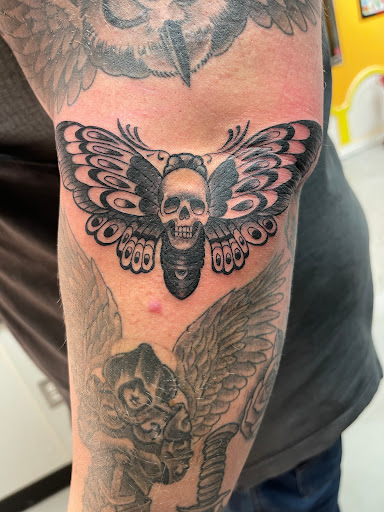 Explore male rib tattoo ideas, creative tattoo ideas in Marietta, available at Monkeys Uncle Tattoo