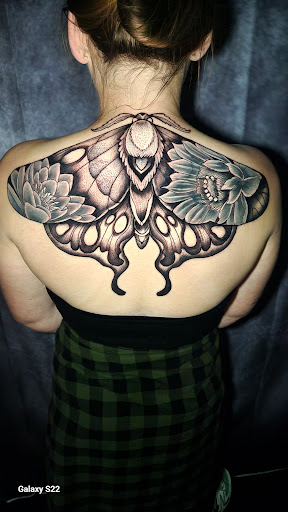 Explore lady thigh tattoo ideas, creative tattoo ideas in Buford, available at Inked Arts Tattoo Studio