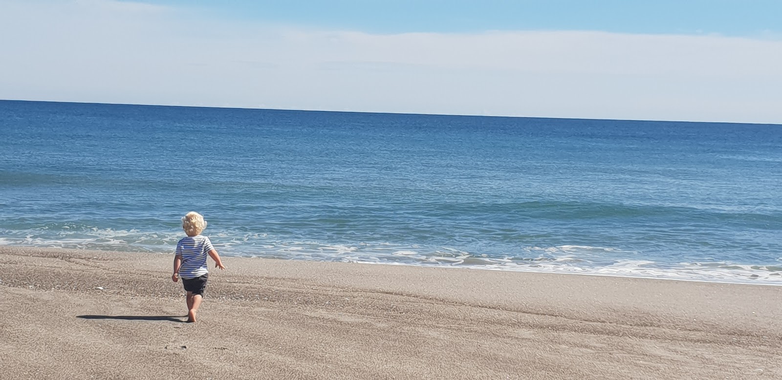 Foto di Matata Beach con costa lunga e dritta