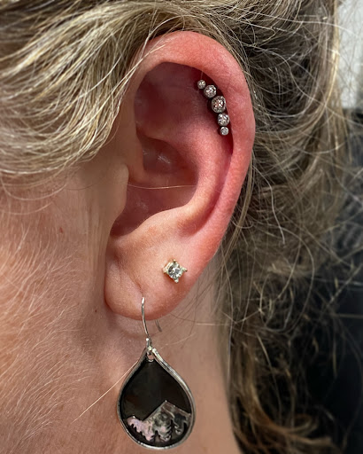 Find female rib tattoo ideas for your next unique tattoo in Oswego at Bodified