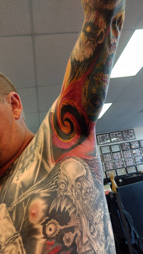 Explore mens behind ear tattoo ideas, creative tattoo ideas in Burlington, available at Tiny Tims Tattoo Shop