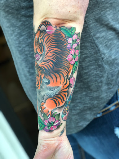 Explore long tattoo ideas, creative tattoo ideas in Erie, available at Wayward Tattoo Studio