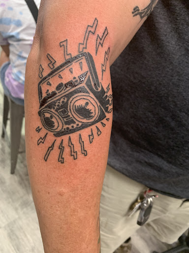 Explore flag tattoo ideas, creative tattoo ideas in Youngstown, available at Industrial Strength Tattoo LLC