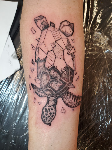 Find animal neck tattoo ideas for your next unique tattoo in Rhinelander at Filling The VOID Tattoo Studio