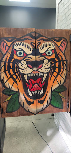 Explore kitty tattoo ideas, creative tattoo ideas in Lees Summit, available at The Cherry Bomb Tattoo Co.