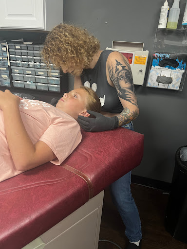 Explore bite mark tattoo ideas, creative tattoo ideas in Osceola, available at Crowned Raven Tattoo Inc.