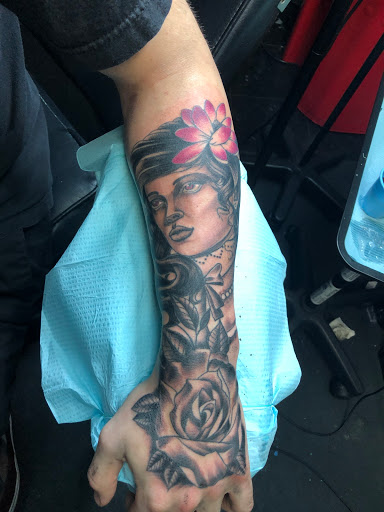 Explore color tattoo sleeve ideas, creative tattoo ideas in Largo, available at Alchemy Tattoos and Body Piercings