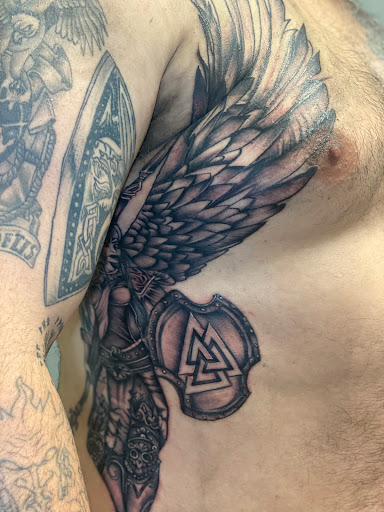 Find rib tattoo ideas for females for your next unique tattoo in Moundsville at Cherry Haze Tattoo