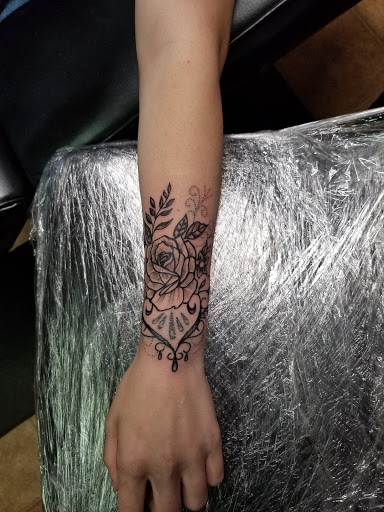 Explore wedding ring tattoo ideas for men, creative tattoo ideas in Conway, available at Primal Urge Tattoos