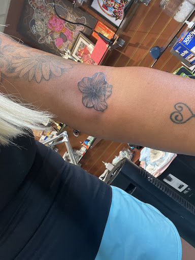 Find dino tattoo ideas for your next unique tattoo in Honolulu at Aloha Tattoo Waikiki Hilton Hawaiian Village Rainbow Bazaar