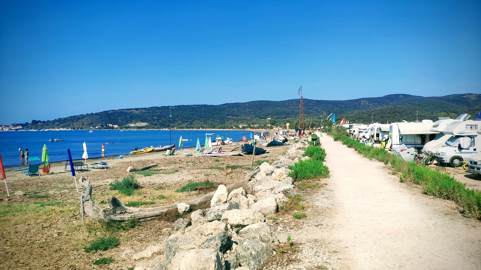 Spiaggia della Fertilia'in fotoğrafı geniş plaj ile birlikte