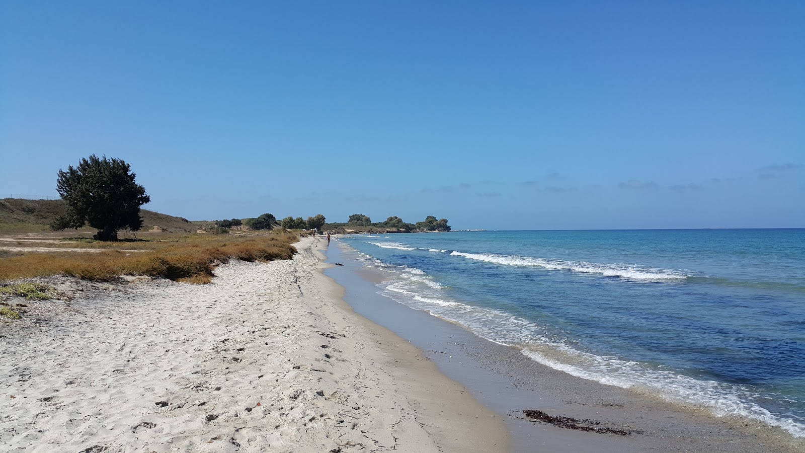 Troulos beach的照片 带有明亮的沙子表面