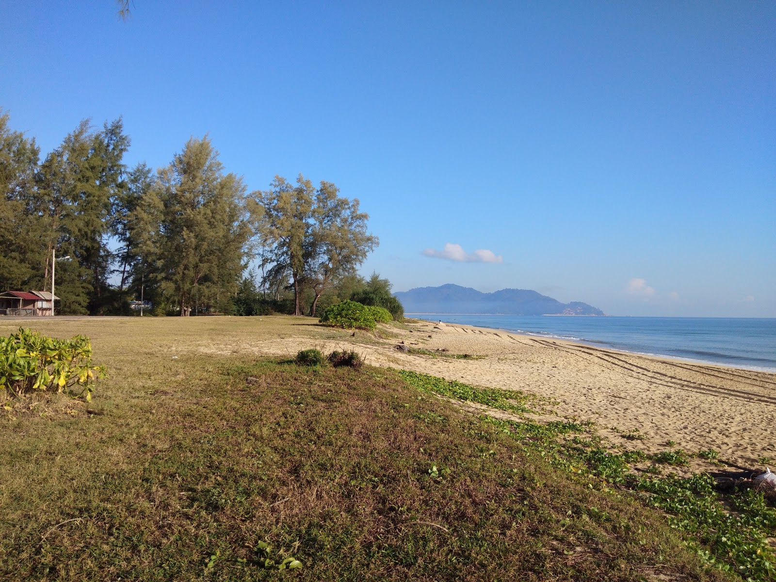 Fotografija Petak Beach z svetel pesek površino