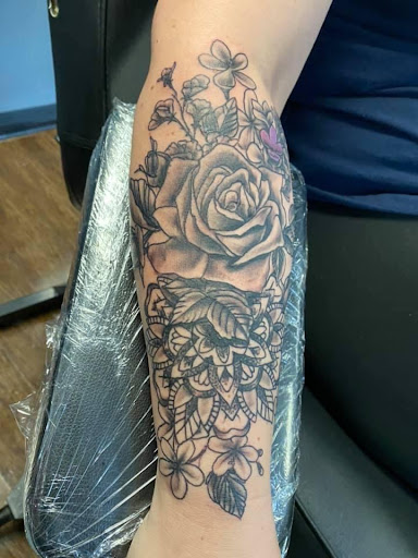 Find tattoo ideas waves for your next unique tattoo in Osceola at Crowned Raven Tattoo Inc.