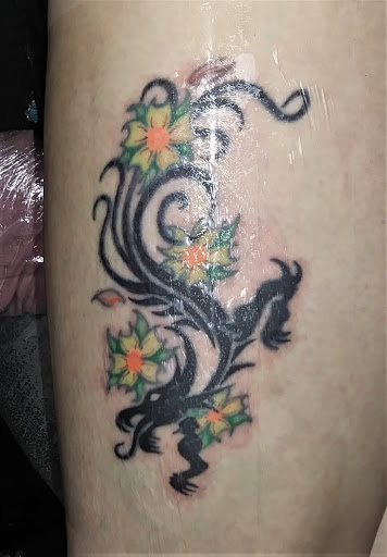 Explore hood neck tattoos ideas, creative tattoo ideas in Carlinville, available at MaloneTattoo