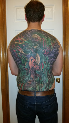 Explore forearm sleeve tattoo ideas for guys, creative tattoo ideas in Dover, available at Walls of Wonder Tattoo And Body Piercing