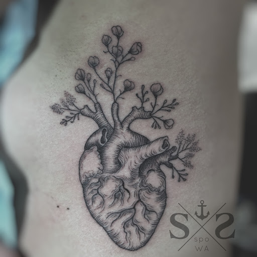 Find small tramp stamp tattoo ideas for your next unique tattoo in Spokane at Anchored Art Tattoo