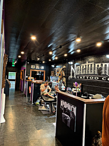 Explore flower leg tattoo ideas, creative tattoo ideas in Denver, available at Nocturnal Tattoo